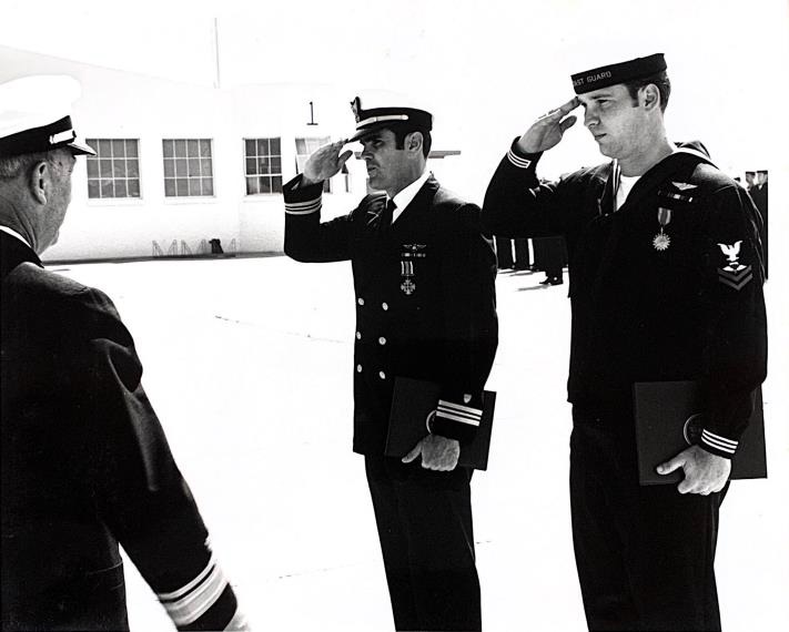 Lt. Cmdr. Paul Lewis earned the Distinguished Flying Cross for this mission, while ASM3 Larry Farmer earned the Air Medal. The medals were presented by Coast Guard District 11 commander, Rear Adm. James Williams, Commander, in a February 1972 ceremony at Air Station San Diego. (Photo courtesy of Larry Farmer) Lt. Cmdr. Paul Lewis earned the Distinguished Flying Cross for this mission, while ASM3 Larry Farmer earned the Air Medal. The medals were presented by Coast Guard District 11 commander, Rear Adm. James Williams, Commander, in a February 1972 ceremony at Air Station San Diego. (Photo courtesy of Larry Farmer)